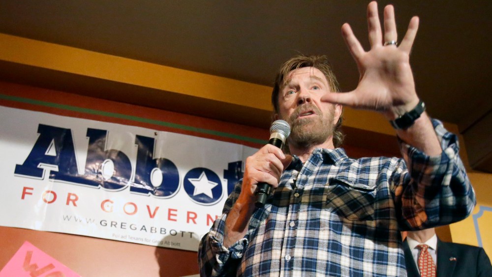 Martial arts star Chuck Norris gives a speech to introduce then, Texas Republican gubernatorial candidate Greg Abbott at a campaign event, Nov. 3, 2014, in Houston, Texas. (Photo by Pat Sullivan/AP)