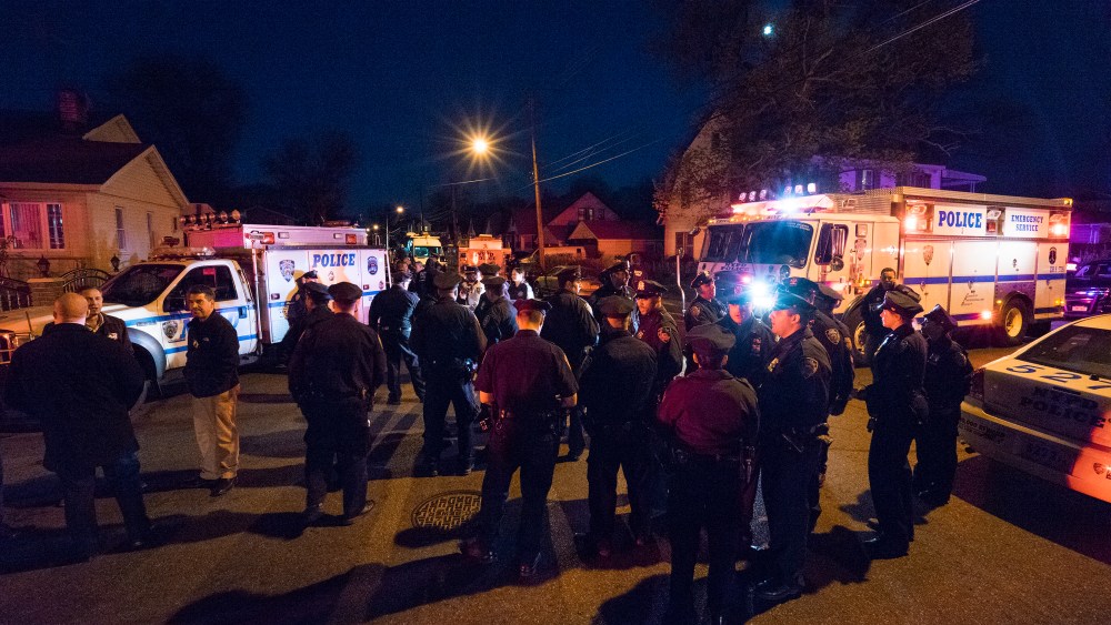 Police work in a neighborhood in the Queens borough of New York on May 2, 2015 after an NYPD officer was shot. He was taken to Jamaica Hospital Medical Center in Queens. (Photo by Craig Ruttle/AP)