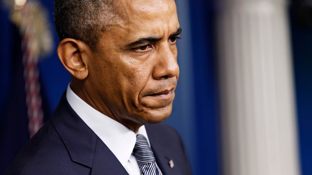 President Barack Obama pauses while speaking about the situation in Ukraine, July 18, 2014, in the Brady Press Briefing Room of the White House in Washington, D.C.