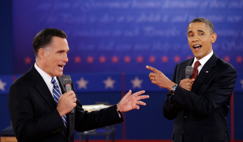 In this Oct. 16, 2012 file photo, President Barack Obama and Republican presidential candidate, former Massachusetts Gov. Mitt Romney exchange views during the second presidential debate at Hofstra University in Hempstead, N.Y.