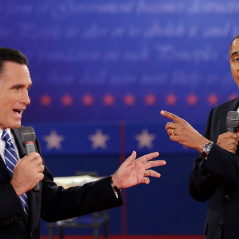 FILE - In this Oct. 16, 2012 file photo, President Barack Obama and Republican presidential candidate, former Massachusetts Gov. Mitt Romney exchange views during the second presidential debate at Hofstra University in Hempstead, N.Y. They interrupt...