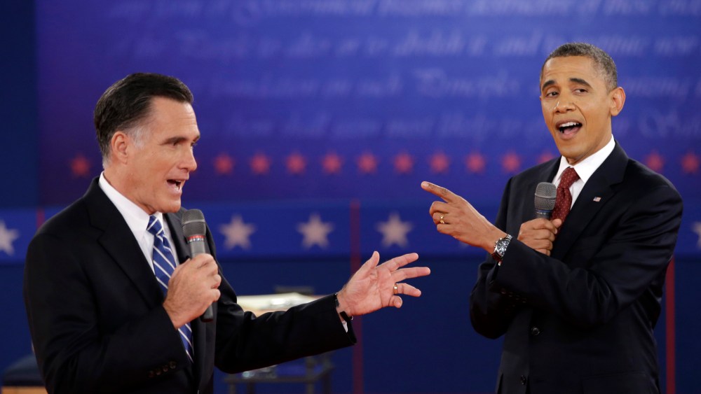 FILE - In this Oct. 16, 2012 file photo, President Barack Obama and Republican presidential candidate, former Massachusetts Gov. Mitt Romney exchange views during the second presidential debate at Hofstra University in Hempstead, N.Y. They interrupt...