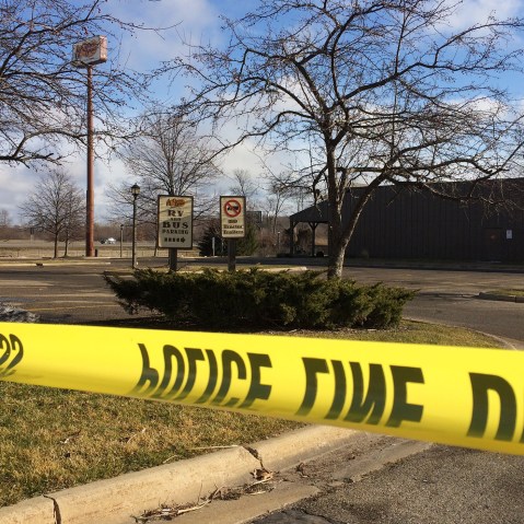 Police tape surrounds the area of a random shooting on Feb. 21, 2016, in Kalamazoo, Mich. Jason Dalton of Kalamazoo County was arrested early Sunday in downtown Kalamazoo after several victims were shot at random. (Photo by Jeff Karoub/AP)