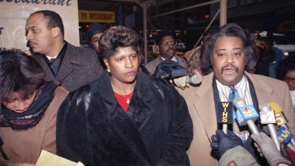 The Rev. Al Sharpton is joined by Thelma Pannell as they talk to reporters in New York, Feb. 14, 1992, concerning the acquittal of a police officer in the shooting death of Pannell's son in 1990. (Photo by Ed Bailey/AP)