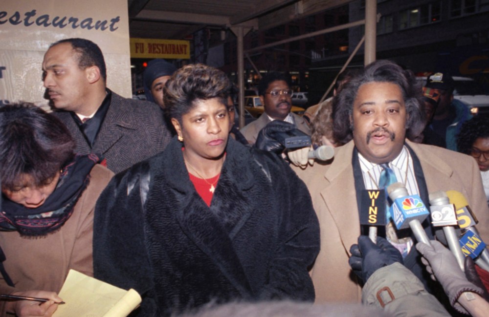 The Rev. Al Sharpton is joined by Thelma Pannell as they talk to reporters in New York, Feb. 14, 1992, concerning the acquittal of a police officer in the shooting death of Pannell's son in 1990. (Photo by Ed Bailey/AP)