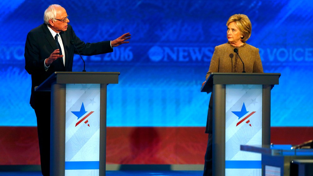 Bernie Sanders offers an apology to Hillary Clinton during a Democratic presidential primary debate, Dec. 19, 2015, at Saint Anselm College in Manchester, N.H. (Photo by Jim Cole/AP)