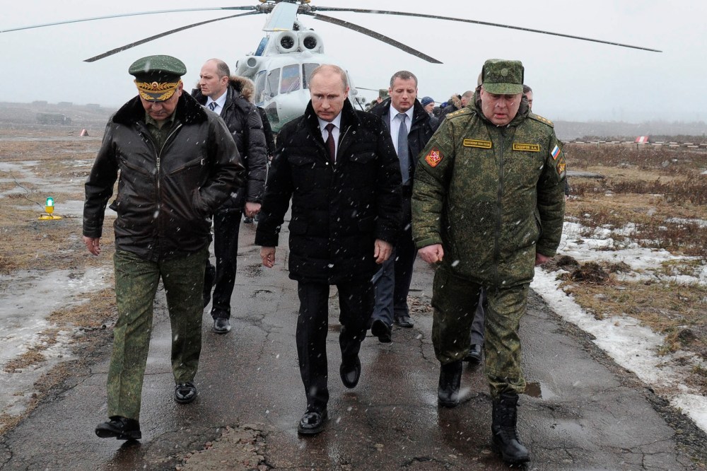 Russian President Vladimir Putin arrives to watch a military exercise near St.Petersburg, Russia, March 3, 2014.