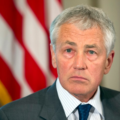 Defense Secretary Chuck Hagel listens as President Barack Obama speaks to media during a meeting with Hagel, Joint Chiefs Chairman Gen. Martin Dempsey, and the service secretaries, service chiefs, and senior enlisted advisers to discuss sexual assault...