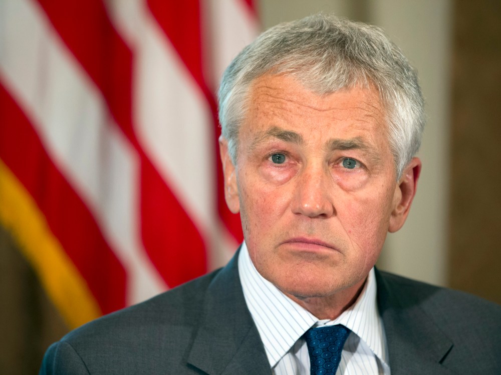 Defense Secretary Chuck Hagel listens as President Barack Obama speaks to media during a meeting with Hagel, Joint Chiefs Chairman Gen. Martin Dempsey, and the service secretaries, service chiefs, and senior enlisted advisers to discuss sexual assault...