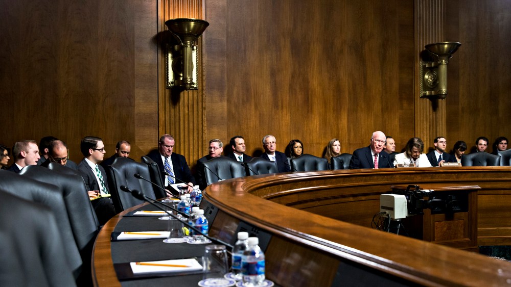 Sen. Patrick Leahy  expresses frustration as the seats on the Republican side of the Senate panel remain empty, causing the cancellation of a meeting to consider President Barack Obama's judicial nominations, Nov. 21, 2013.