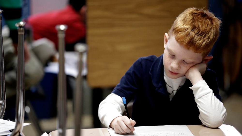 A second grader at George Buck Elementary School in Indianapolis, works on writing, March 25, 2014.