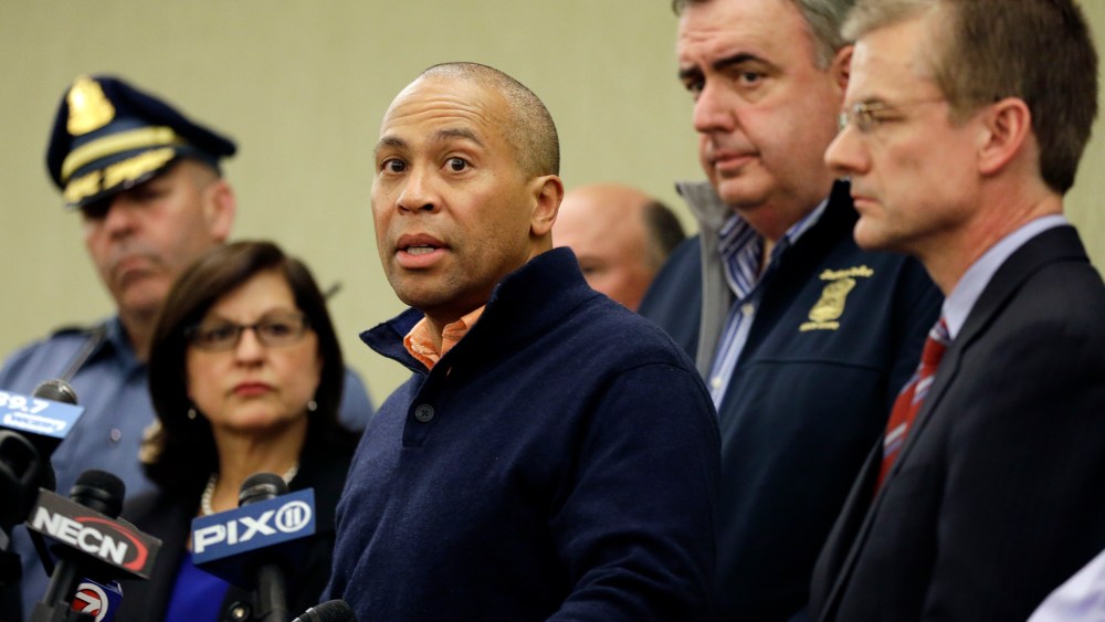 Massachusetts Gov. Deval Patrick speaks as Boston Police Commissioner Ed Davis, middle, and FBI Special Agent in Charge Richard DesLauriers, far right, listen at a news conference in Boston Monday, April 15, 2013 regarding two bombs which exploded in...