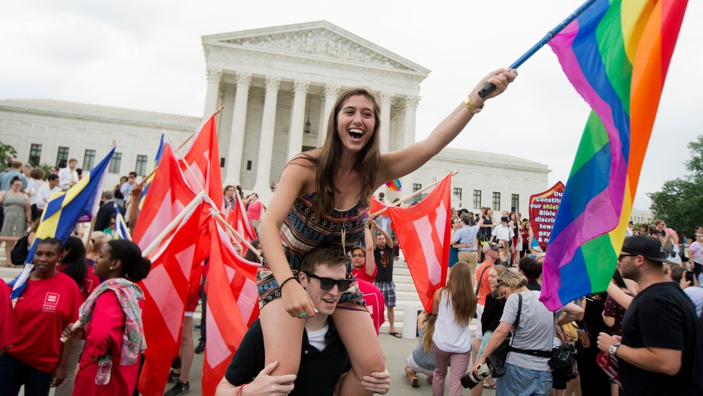 Sasha Altschuler of San Diego, Calif., joins the celebrations outside the Supreme Court in Washington, June 26, 2015 after the court declared that same-sex couples have a right to marry anywhere in the US. (Photo by Manuel Balce Ceneta/AP)