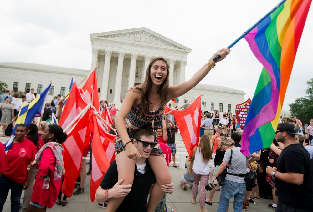 Sasha Altschuler of San Diego, Calif., joins the celebrations outside the Supreme Court in Washington, June 26, 2015 after the court declared that same-sex couples have a right to marry anywhere in the US. (Photo by Manuel Balce Ceneta/AP)