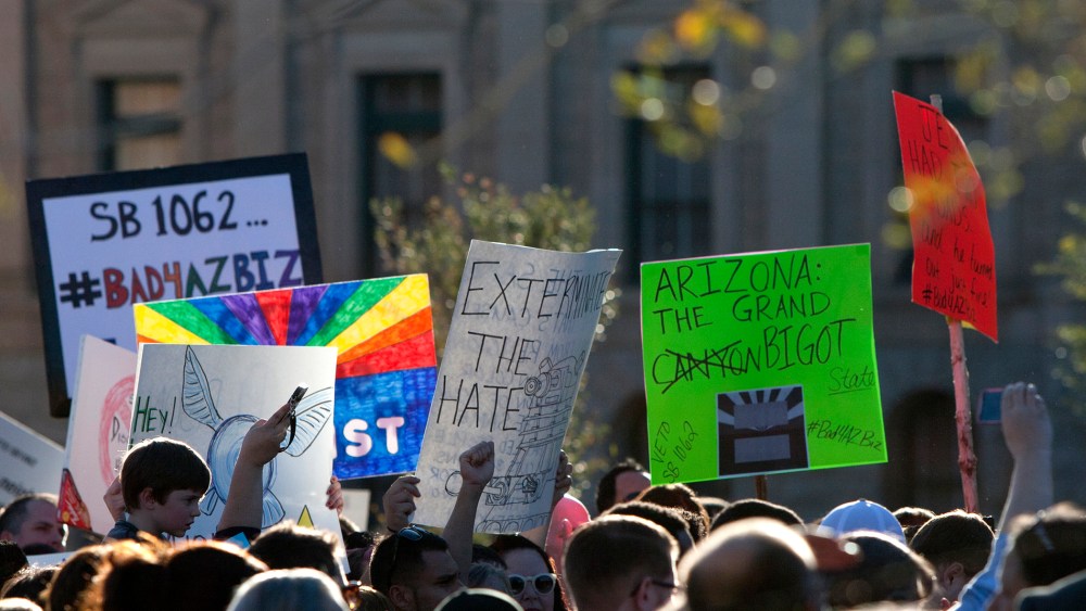 Opponents of the SB1062, a religious freedom bill, urged Gov. Brewer to veto the bill during a protest rally at the state Capitol, Feb. 21, 2014.
