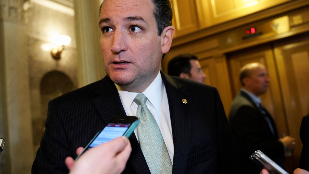 Sen. Ted Cruz talks with reporters following a vote on Capitol Hill in Washington, Wednesday, Oct. 9, 2013.