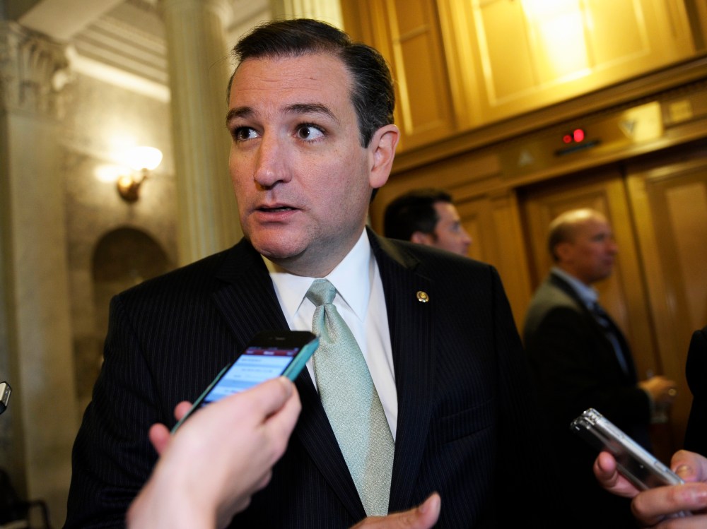 Sen. Ted Cruz talks with reporters following a vote on Capitol Hill in Washington, Wednesday, Oct. 9, 2013.