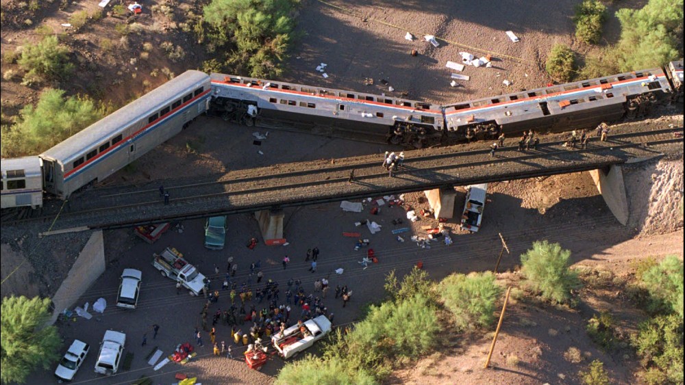 An Amtrak Sunset Limited train lies on its side in a creek bed after derailing 55 miles southwest of Phoenix near Hyder, Ariz., Oct. 9, 1995. (Photo by Scott Troyanos/AP)
