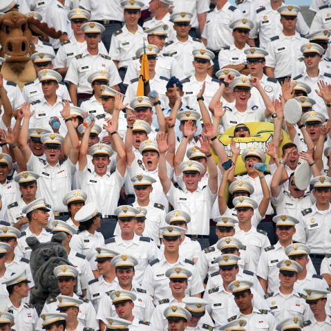 Cadets cheer during the first half of an NCAA college football game between Army and Fordham in West Point, N.Y. More than a dozen students were injured during the annual pillow fight by first year cadets on Aug. 20, 2015. (Photo by Mike Groll/AP)
