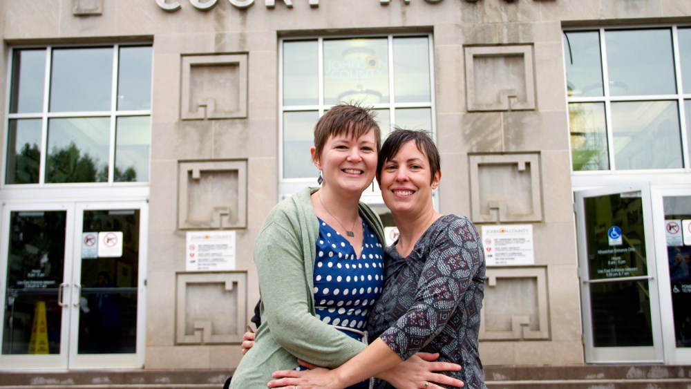In this photo provided by Liz Dickinson, Kelli, left, and Angela pose for a picture after their wedding ceremony at the Johnson County Court House in Olathe, Kan., Friday, Oct. 10, 2014. (Liz Dickinson-Snyder/piperlucyphotography.org/AP)