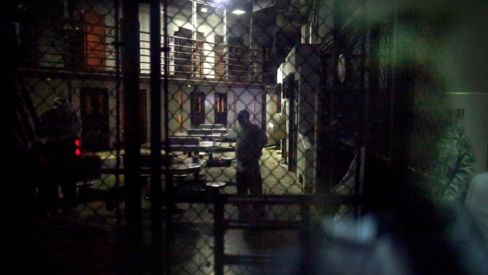 In this photo reviewed by the U.S. military, detainees behind a mirrored one-way window are pictured in Camp VI detention facility at Guantanamo Bay Naval Base, Cuba, Nov. 20, 2013. (Photo by Charles Dharapak/AP)