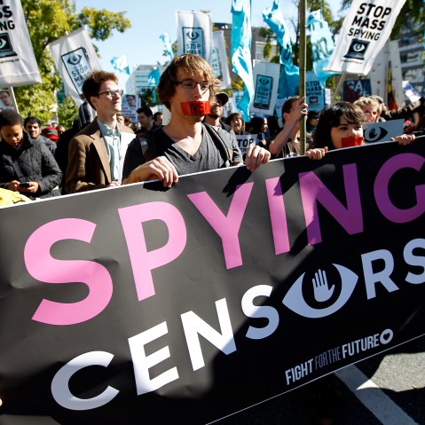 Demonstrators March through Washington towards the National Mall to rally and demand that the U.S. Congress investigate the National Security Agency's mass surveillance programs Saturday, Oct. 26, 2013.