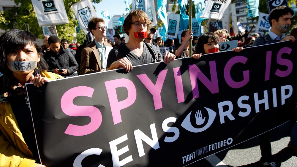 Demonstrators March through Washington towards the National Mall to rally and demand that the U.S. Congress investigate the National Security Agency's mass surveillance programs Saturday, Oct. 26, 2013.