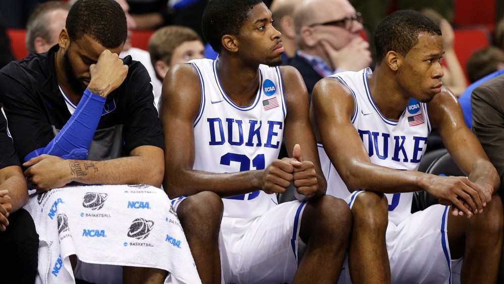 Duke's Josh Hairston, Amile Jefferson and Rodney Hood sit on the bench during the second half of an NCAA college basketball second-round game, March 21, 2014.