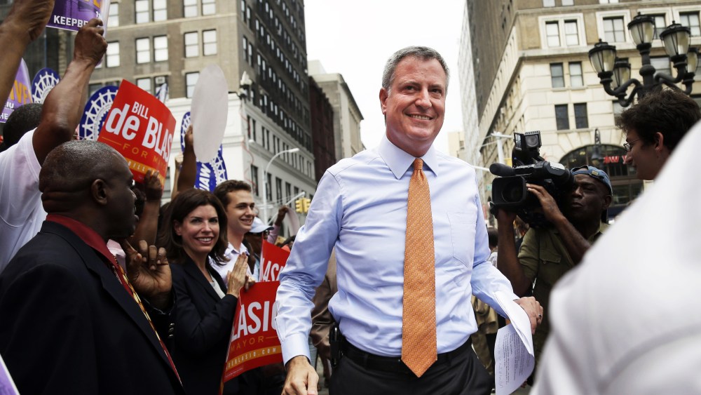 Democratic mayoral candidate Bill de Blasio, center, arrives at a rally in the Brooklyn borough of New York, Thursday, Sept. 12, 2013.