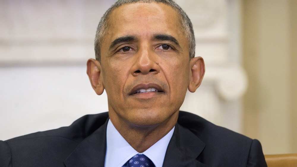President Obama speaks in the Oval Office of the White House, Jan. 4, 2016, during a meeting with law enforcement officials to discuss executive actions the president can take to curb gun violence. (Photo by Pablo Martinez Monsivais/AP)