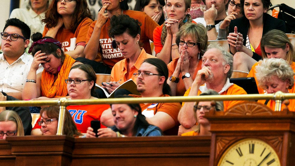 Protesters react during a debate on abortion held at the State Capitol in Austin, TX, June 23, 2013.