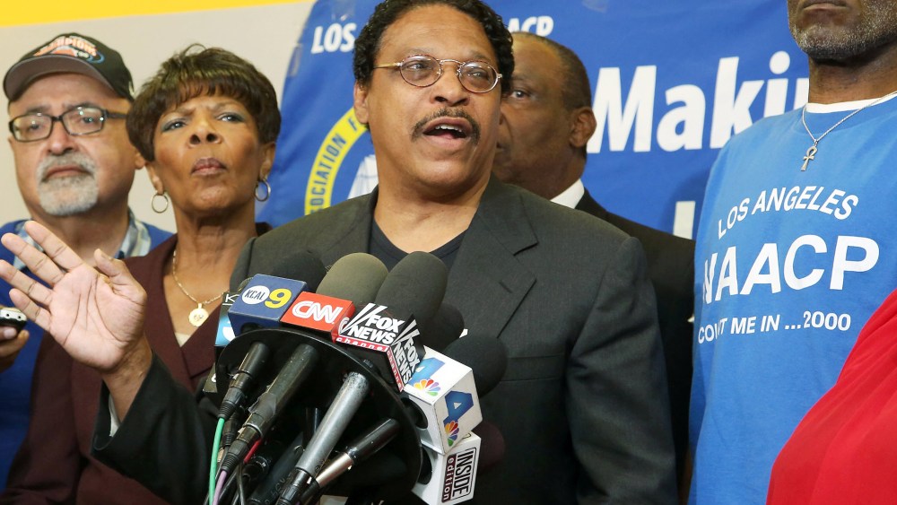 Leon Jenkins, center, president of the Los Angeles chapter of the NAACP speaks at a news conference in Culver City, Calif., April 28, 2014.