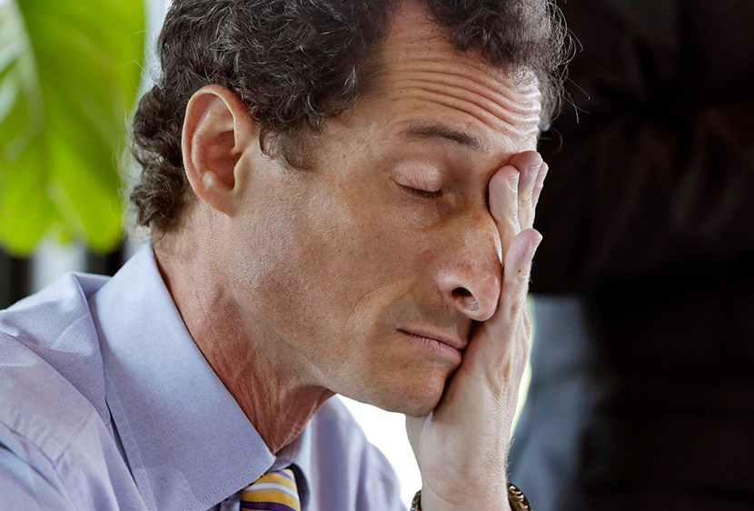 New York mayoral candidate Anthony Weiner rubs his eyes during a candidate forum on small business, in the Inwood section of the borough of Manhattan, in New York,  Tuesday, July 30, 2013. (Photo by Richard Drew/AP)
