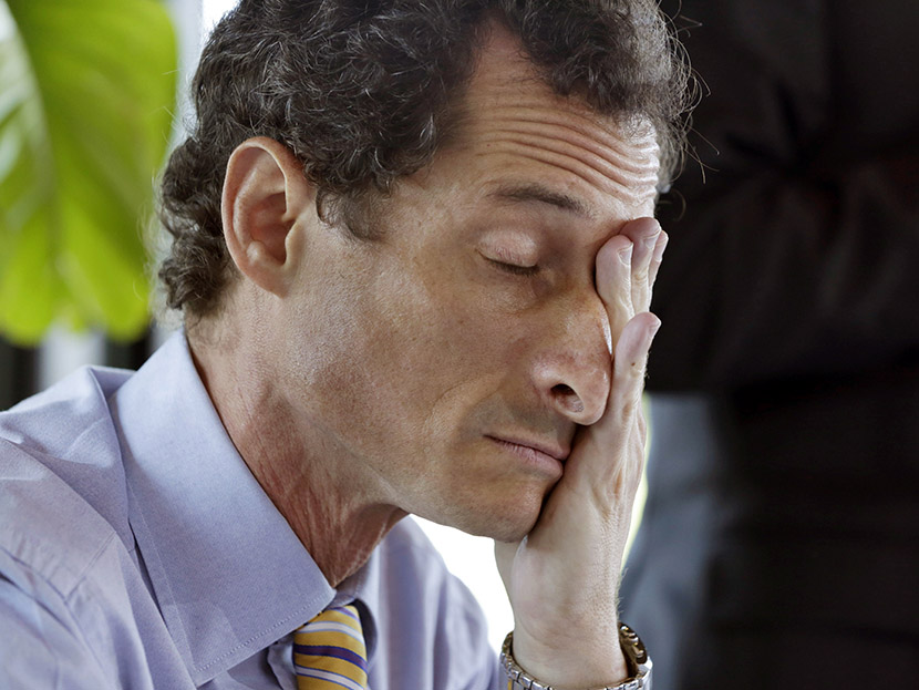 New York mayoral candidate Anthony Weiner rubs his eyes during a candidate forum on small business, in the Inwood section of the borough of Manhattan, in New York, Tuesday, July 30, 2013. (Photo by Richard Drew/AP)