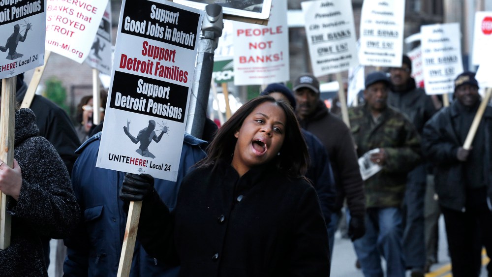 Jalita Shabazz joins protesters during a rally outside The Theodore Levin United States Courthouse in Detroit, Wednesday, Oct. 23, 2013.