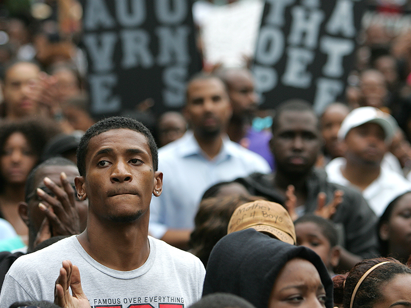 Protesters march and hold signs in the No Justice No Peace- "March Against Gun Violence"  walk from Lake Eola in downtown Orlando, to the Orange County Courthouse on Wednesday, July 17, 2013.  (Photo by Alex Menendez/AP)