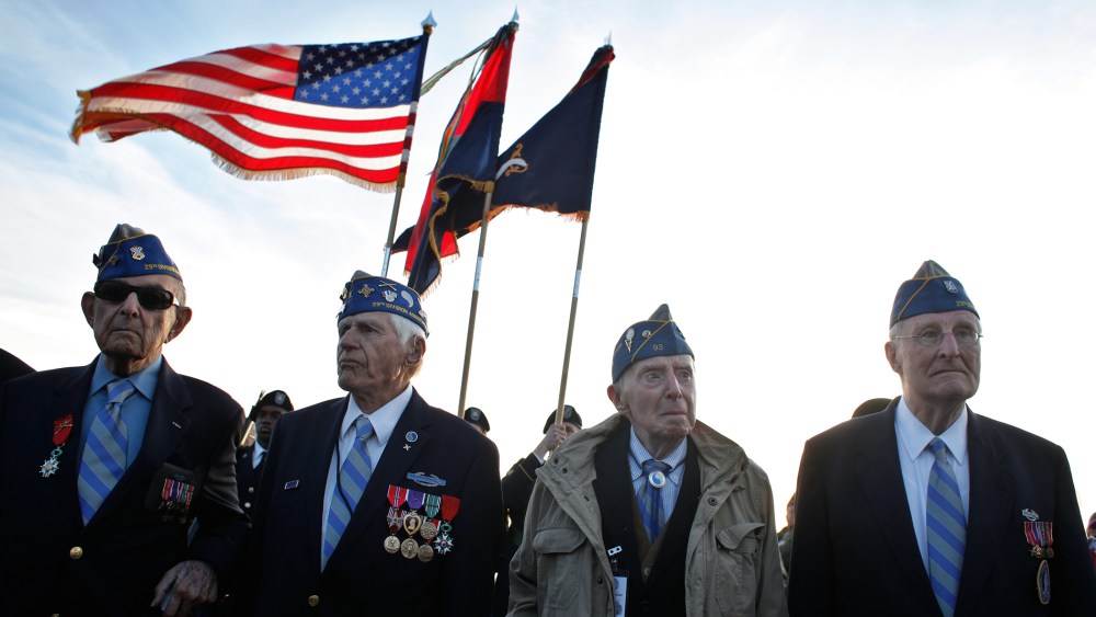 From left, World War II veterans of the U.S. 29th Infantry Division, Hal Baumgarten, 90 from Pennsylvania, Steve Melnikoff, 94, from Maryland, Don McCarthy, 90 from Rhode Island, and Morley Piper, 90, from Massachusetts, attend a D-Day commemoration, on O