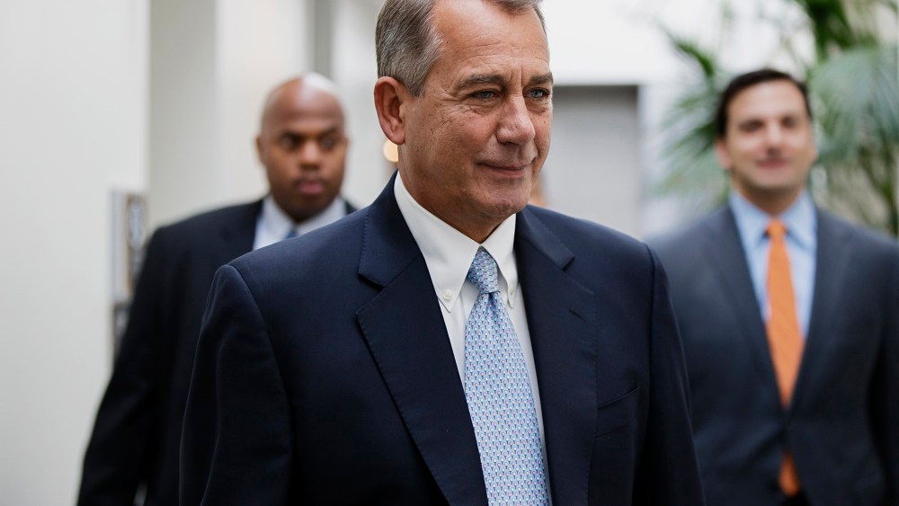 John Boehner smiles as walks to a strategy meeting with fellow Republicans, Feb. 4, 2014.