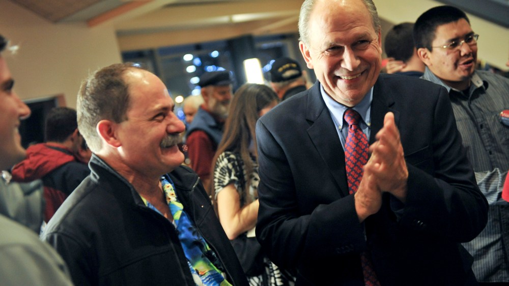 Alaska Independent gubernatorial candidate Bill Walker, right, laughs while awaiting election results, Nov. 4, 2014, in Anchorage, Alaska. (Photo by Michael Dinneen/AP)