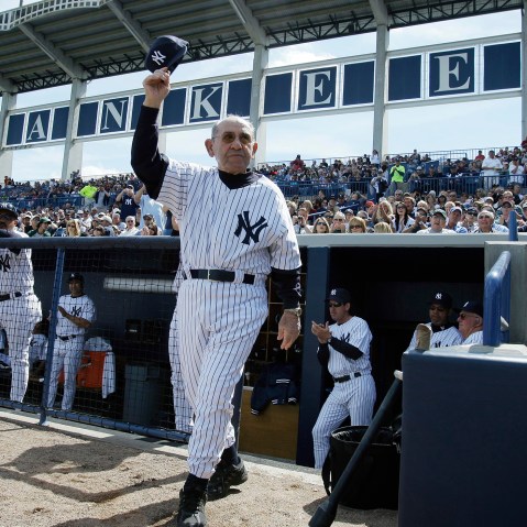 Former New York Yankees catcher Yogi Berra acknowledges fans before a spring training baseball game against the University of South Florida, Feb. 29, 2008, in Tampa, Fla. (Photo by Julie Jacobson/AP)
