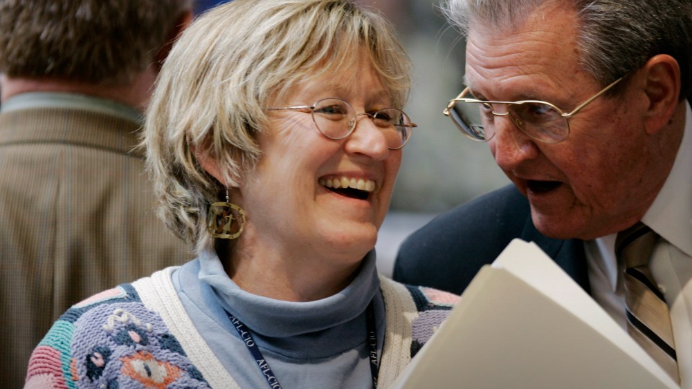 Democratic Rep. Mary Lou Marzian of Louisville shares a light moment with a fellow Representative on the House floor in Frankfort, Ky., March 3, 2009. (Photo by Ed Reinke/AP)