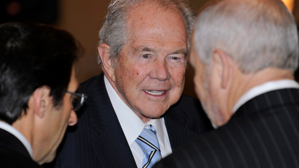 Rev. Pat Robertson, center, talks to attendees at a prayer breakfast at the Capitol in Richmond, Va. on Jan. 16, 2010. (Photo by Clem Britt/AP)