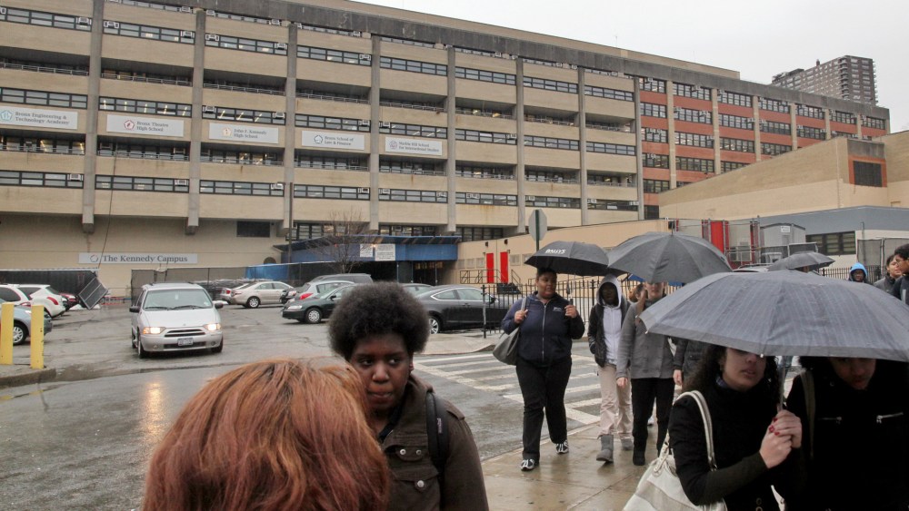 Students leave the John F. Kennedy multi-high school campus during afternoon showers in the Bronx, N.Y. on March 12, 2010. (Photo by Bebeto Matthews/AP)