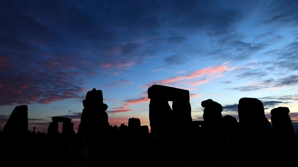 The Stonehenge monument on Salisbury Plain, southern England at sunrise.