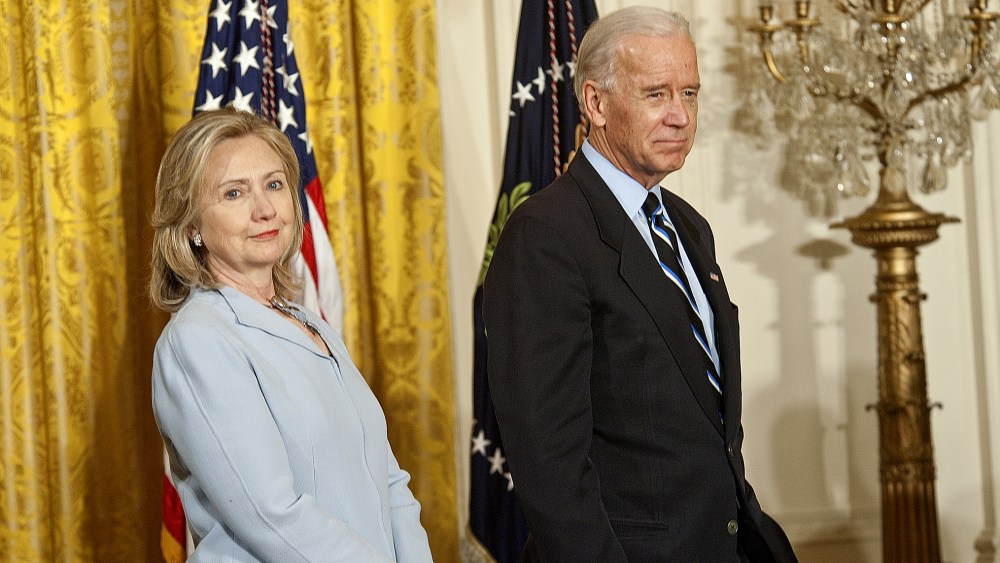 Then-Secretary of State Hillary Clinton and Vice President Joe Biden at the White House, Washington, D.C., April 28, 2011. (Photo by Rex Features/AP)