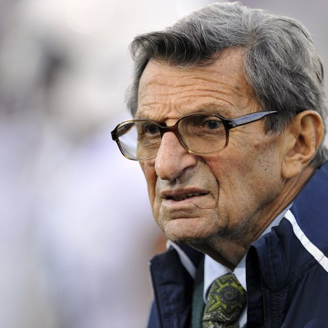 In this Oct. 22, 2011 file photo, Penn State coach Joe Paterno stands on the field before his team's NCAA college football game against Northwestern, in Evanston, Ill. (Photo by Jim Prisching/AP)
