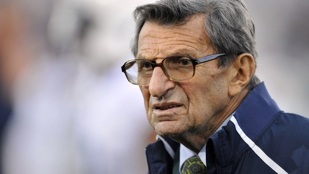 In this Oct. 22, 2011 file photo, Penn State coach Joe Paterno stands on the field before his team's NCAA college football game against Northwestern, in Evanston, Ill. (Photo by Jim Prisching/AP)