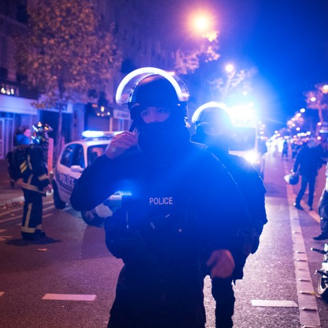 Elite police officers arrive outside the Bataclan theater in Paris, France, Nov. 13, 2015. (Photo by Kamil Zihnioglu/AP)