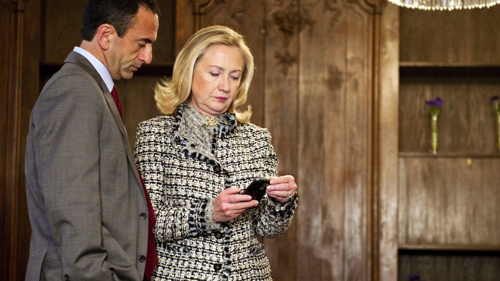 US Secretary of State Hillary Clinton looks at her phone during the 48th Munich Security Conference at the Bayerischer Hof hotel in Munich, Germany, Feb. 4, 2012. (Photo by Jim Watson/Pool/AP)