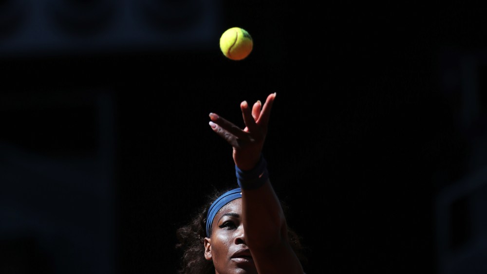 Serena Williams from U.S. serves during a match at the Madrid Open tennis tournament, in Madrid, May 11, 2013. (Photo by Andres Kudacki/AP)